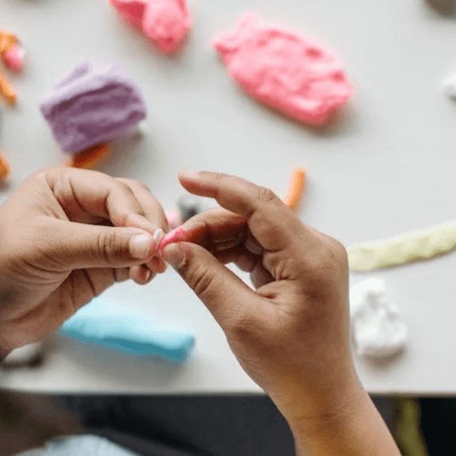 Child playing with play dough